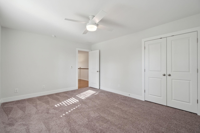 unfurnished bedroom with ceiling fan, carpet floors, and a closet