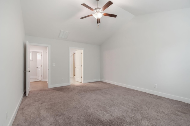 unfurnished bedroom with light carpet, lofted ceiling, and ceiling fan