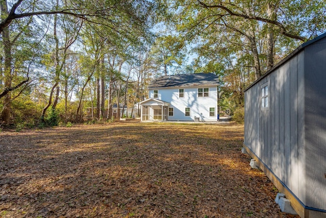 view of yard featuring a sunroom