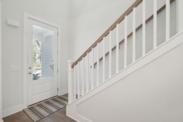 foyer entrance with dark hardwood / wood-style flooring