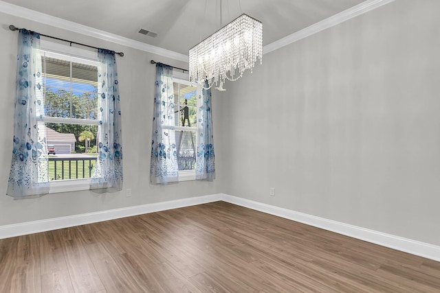 404 Bowstring Dr, Huger, SC 29450 - empty room featuring a chandelier, crown molding, wood finished floors, baseboards, and plenty of natural light