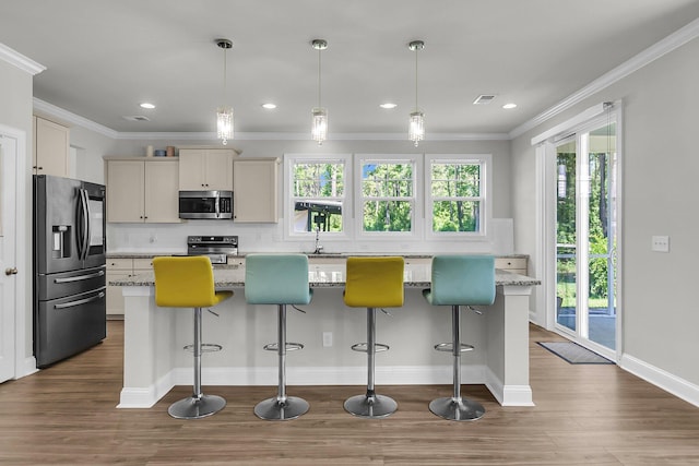 404 Bowstring Dr, Huger, SC 29450 - kitchen featuring appliances with stainless steel finishes, dark wood-style flooring, tasteful backsplash, crown molding, and a sink