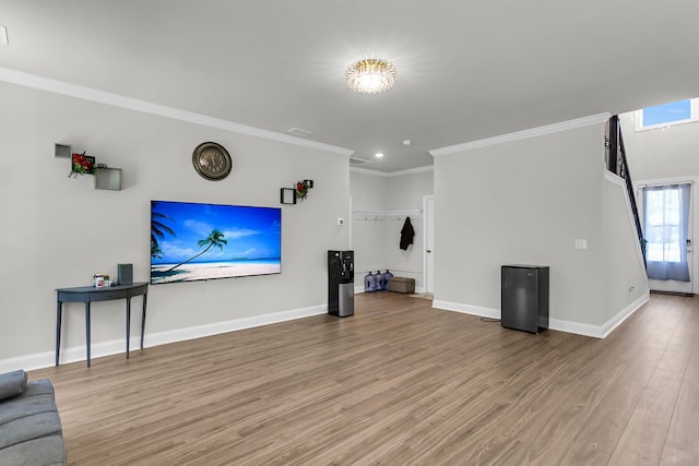 404 Bowstring Dr, Huger, SC 29450 - unfurnished living room featuring light wood-style flooring, crown molding, baseboards, and recessed lighting