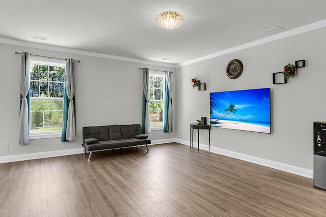 404 Bowstring Dr, Huger, SC 29450 - sitting room featuring wood finished floors, crown molding, and baseboards