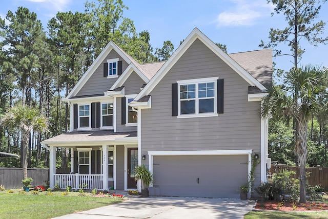 404 Bowstring Dr, Huger, SC 29450 - view of front of house featuring a porch, an attached garage, concrete driveway, and a shingled roof