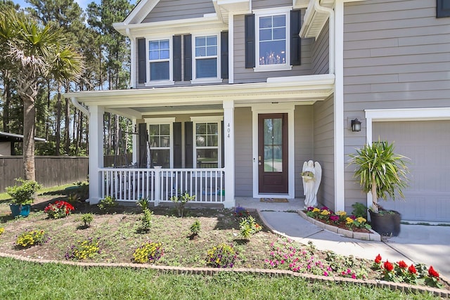 404 Bowstring Dr, Huger, SC 29450 - view of front of property featuring covered porch and a garage