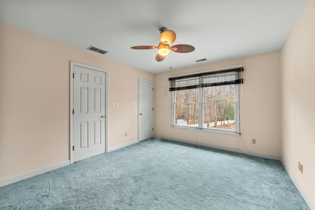 1560 NW Lee Blvd, Orangeburg, SC 29118 - spare room with baseboards, visible vents, and carpet floors