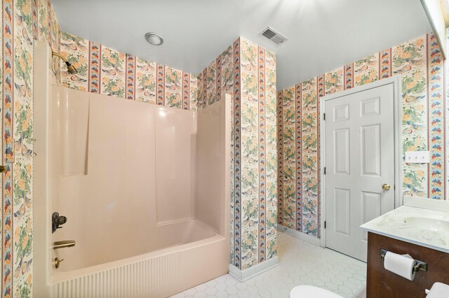 1560 NW Lee Blvd, Orangeburg, SC 29118 - bathroom with visible vents,  shower combination, tile patterned flooring, and wallpapered walls