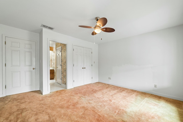 1560 NW Lee Blvd, Orangeburg, SC 29118 - unfurnished bedroom with visible vents, a ceiling fan, ensuite bath, a closet, and carpet