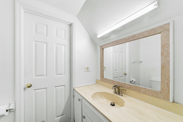 1560 NW Lee Blvd, Orangeburg, SC 29118 - half bath with vanity, vaulted ceiling, and toilet