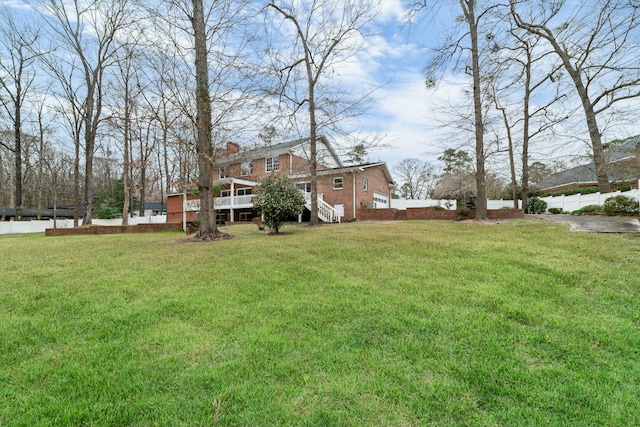 1560 NW Lee Blvd, Orangeburg, SC 29118 - view of yard featuring a deck and fence