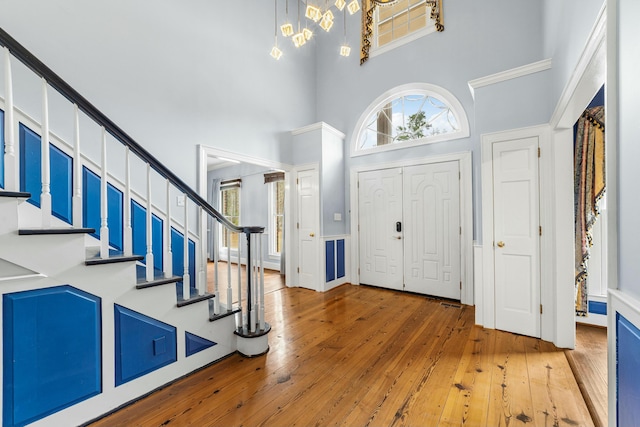 1560 NW Lee Blvd, Orangeburg, SC 29118 - entrance foyer with stairway, a towering ceiling, and hardwood / wood-style flooring