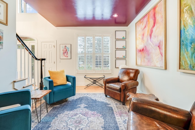 living area with hardwood / wood-style floors