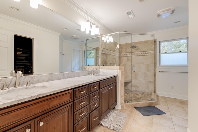 bathroom with tile patterned flooring, vanity, crown molding, and a shower with door