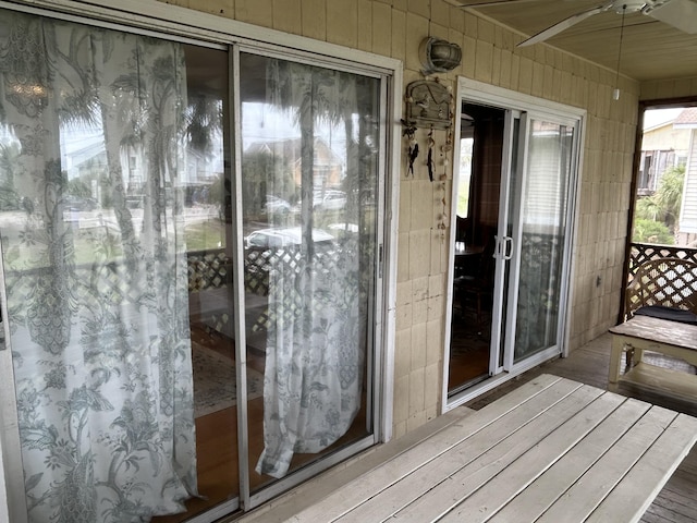 1736 E Ashley Ave, Folly Beach, SC 29439 - unfurnished sunroom with ceiling fan, wood finished floors, and wooden walls