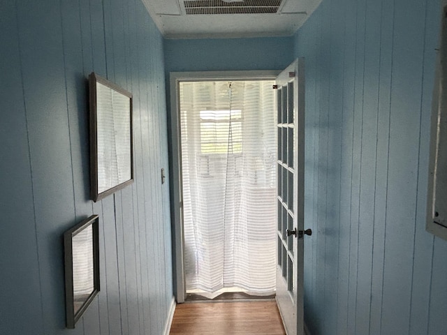 1736 E Ashley Ave, Folly Beach, SC 29439 - doorway with wood finished floors and wooden walls