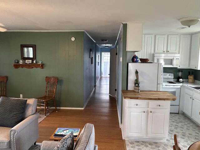 1736 E Ashley Ave, Folly Beach, SC 29439 - kitchen featuring white appliances, light wood-style floors, white cabinetry, crown molding, and butcher block countertops
