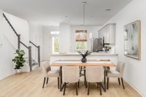 dining area with light hardwood / wood-style flooring