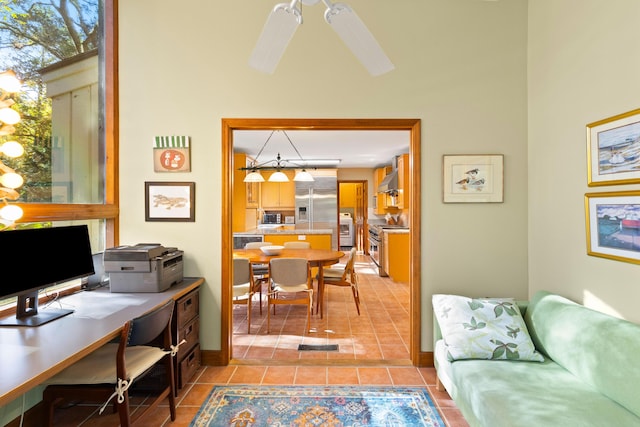 tiled office featuring ceiling fan