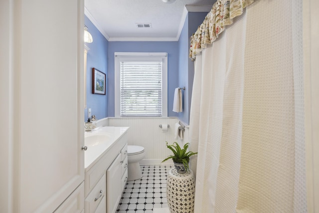 647 Ellis St, Mount Pleasant, SC 29464 - bathroom with a wainscoted wall, vanity, toilet, crown molding, and a shower with curtain