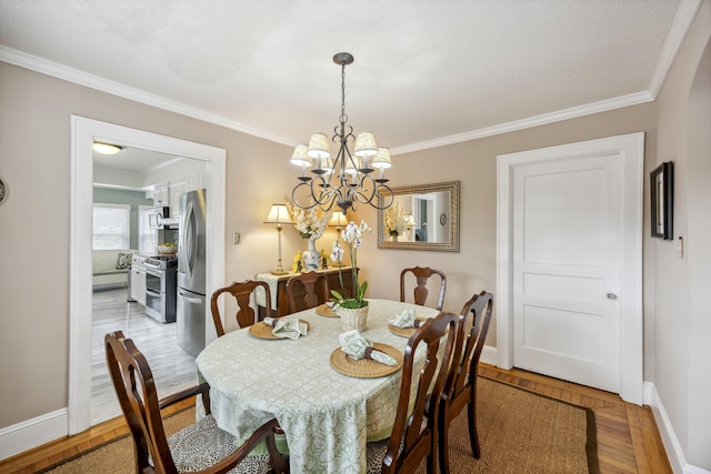 647 Ellis St, Mount Pleasant, SC 29464 - dining room featuring baseboards, crown molding, and a chandelier