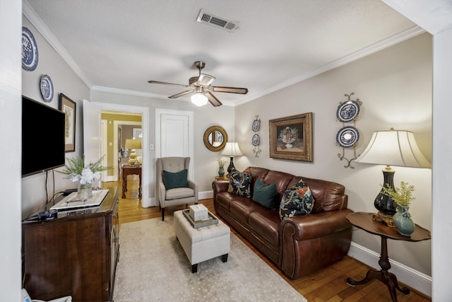 647 Ellis St, Mount Pleasant, SC 29464 - living room featuring wood finished floors, ceiling fan, ornamental molding, and baseboards