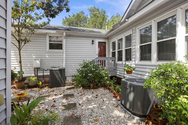 647 Ellis St, Mount Pleasant, SC 29464 - property entrance with cooling unit and a shingled roof