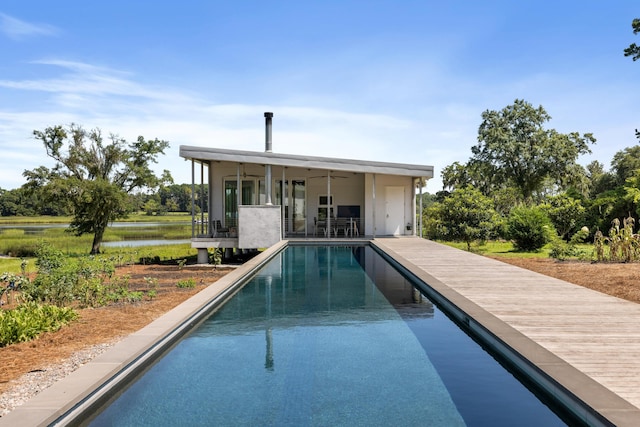 view of pool featuring ceiling fan