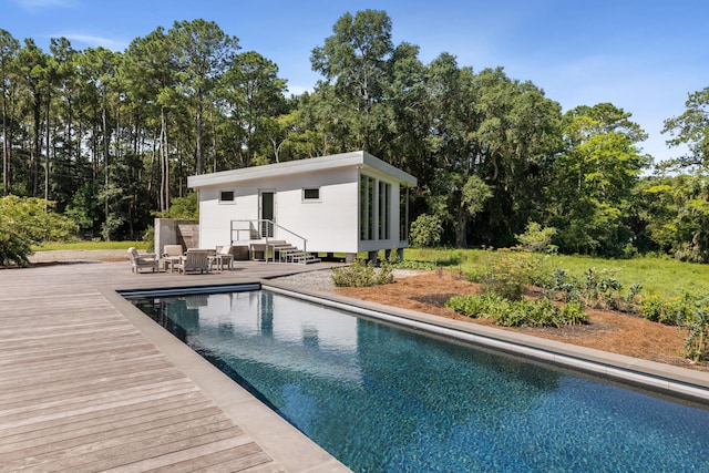 view of pool with a wooden deck