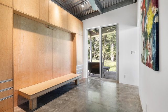 mudroom featuring beam ceiling