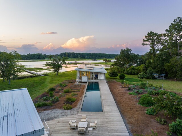 exterior space featuring a yard and a water view