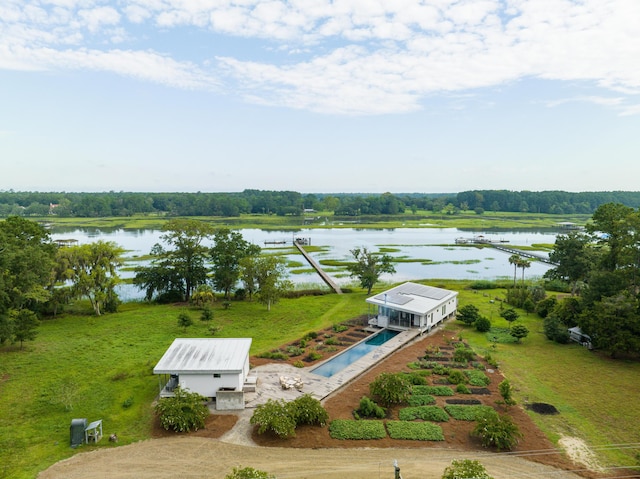 birds eye view of property with a water view