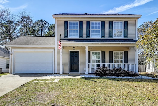 traditional-style house featuring an attached garage, driveway, a porch, and a front yard