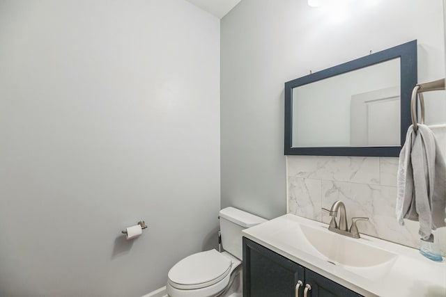 9711 Fanning Basket Ln, Ladson, SC 29456 - half bathroom featuring vanity, toilet, and backsplash