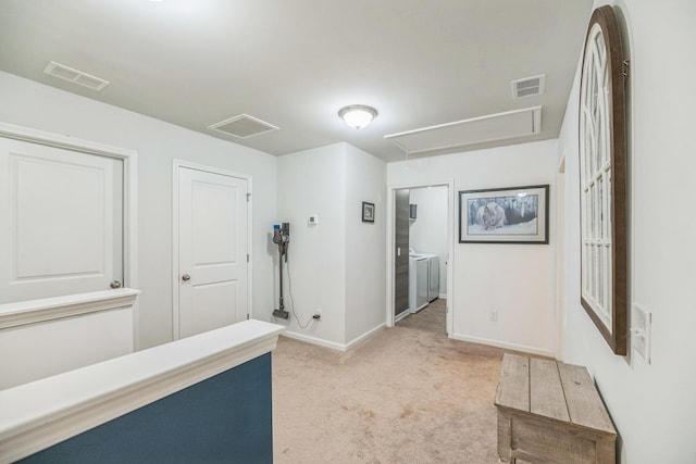 9711 Fanning Basket Ln, Ladson, SC 29456 - hallway with washer and dryer, attic access, light carpet, and baseboards