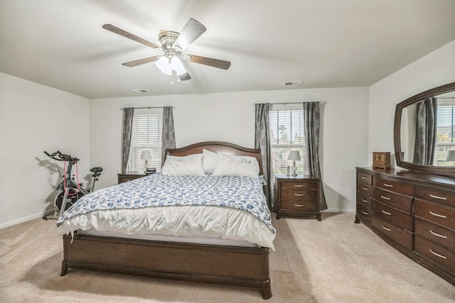 9711 Fanning Basket Ln, Ladson, SC 29456 - bedroom with light colored carpet, multiple windows, baseboards, and ceiling fan
