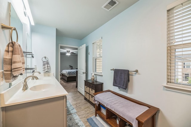 9711 Fanning Basket Ln, Ladson, SC 29456 - full bathroom with connected bathroom, double vanity, wood finished floors, and ceiling fan