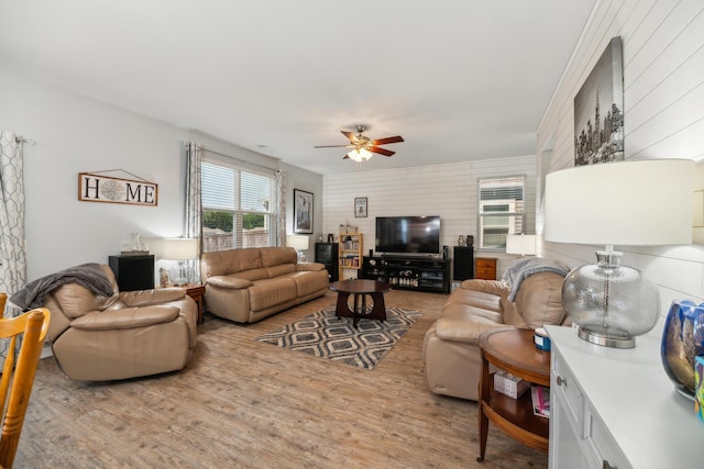 9711 Fanning Basket Ln, Ladson, SC 29456 - living area featuring ceiling fan, wood finished floors, and wood walls