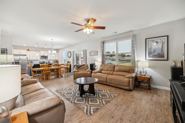 9711 Fanning Basket Ln, Ladson, SC 29456 - living area with a ceiling fan, light wood finished floors, plenty of natural light, and baseboards