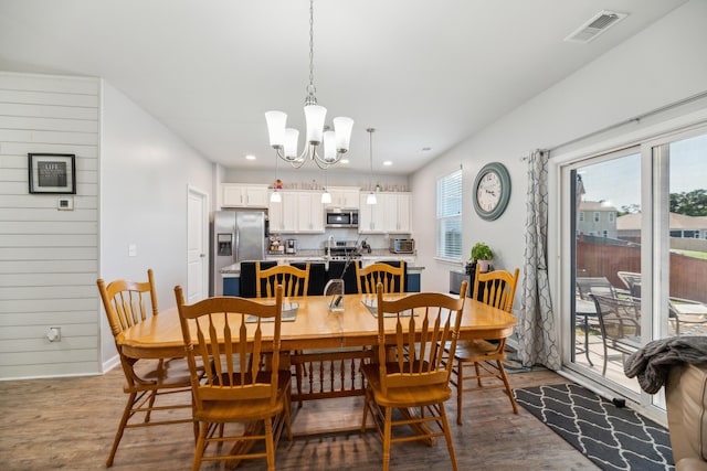 9711 Fanning Basket Ln, Ladson, SC 29456 - dining space with a chandelier, wood finished floors, recessed lighting, and baseboards