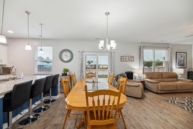 9711 Fanning Basket Ln, Ladson, SC 29456 - dining room featuring wood finished floors and a chandelier