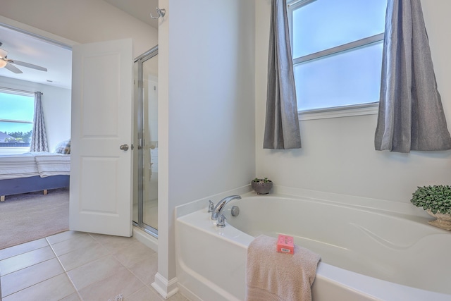 bathroom featuring a shower stall, tile patterned flooring, a bath, and ensuite bathroom