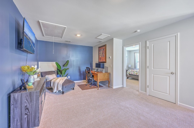 carpeted home office featuring attic access, visible vents, and baseboards