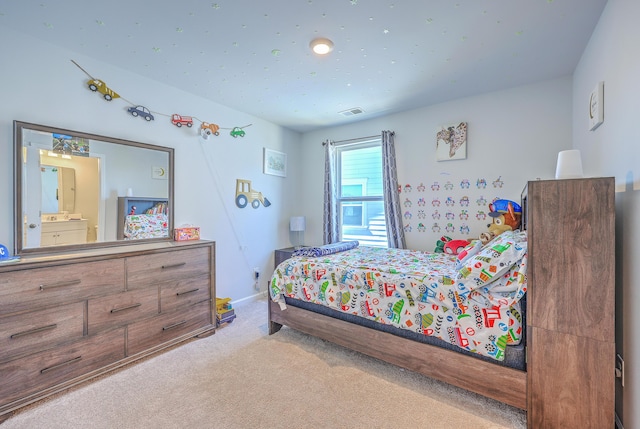 bedroom with carpet, visible vents, and baseboards