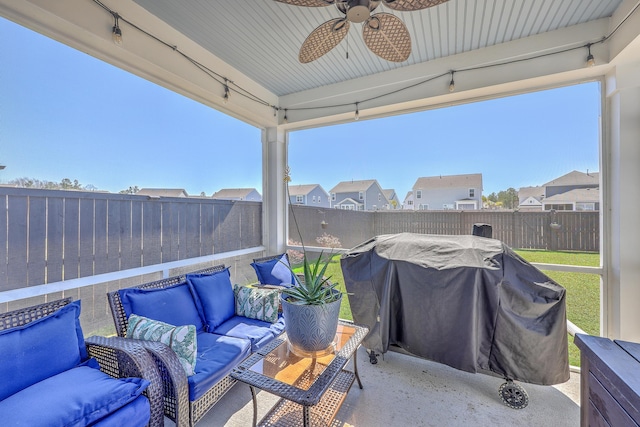 view of patio featuring a fenced backyard, outdoor lounge area, a ceiling fan, grilling area, and a residential view