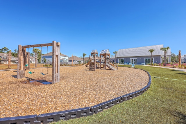 communal playground featuring a lawn