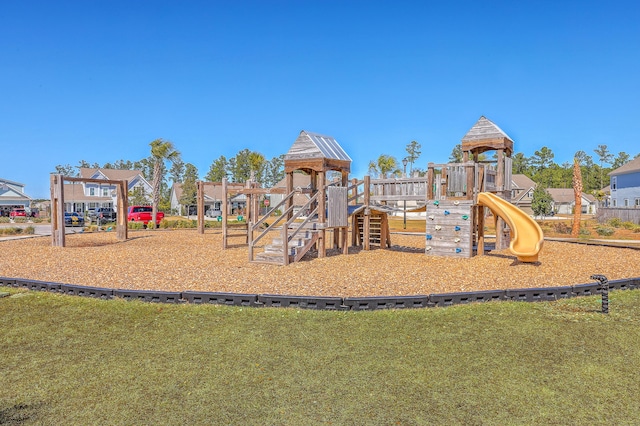 communal playground featuring a yard