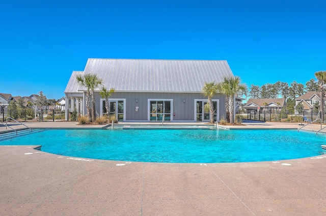 pool featuring a patio area and fence