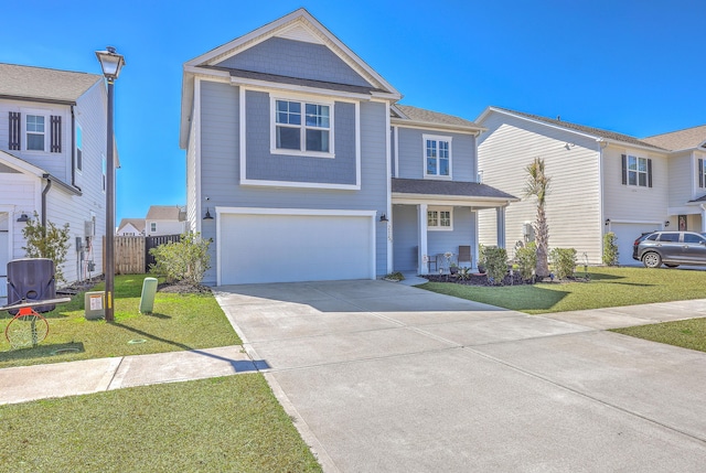 traditional-style home with a front yard, driveway, an attached garage, and fence