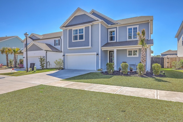 view of front of house with driveway, a front lawn, an attached garage, and fence